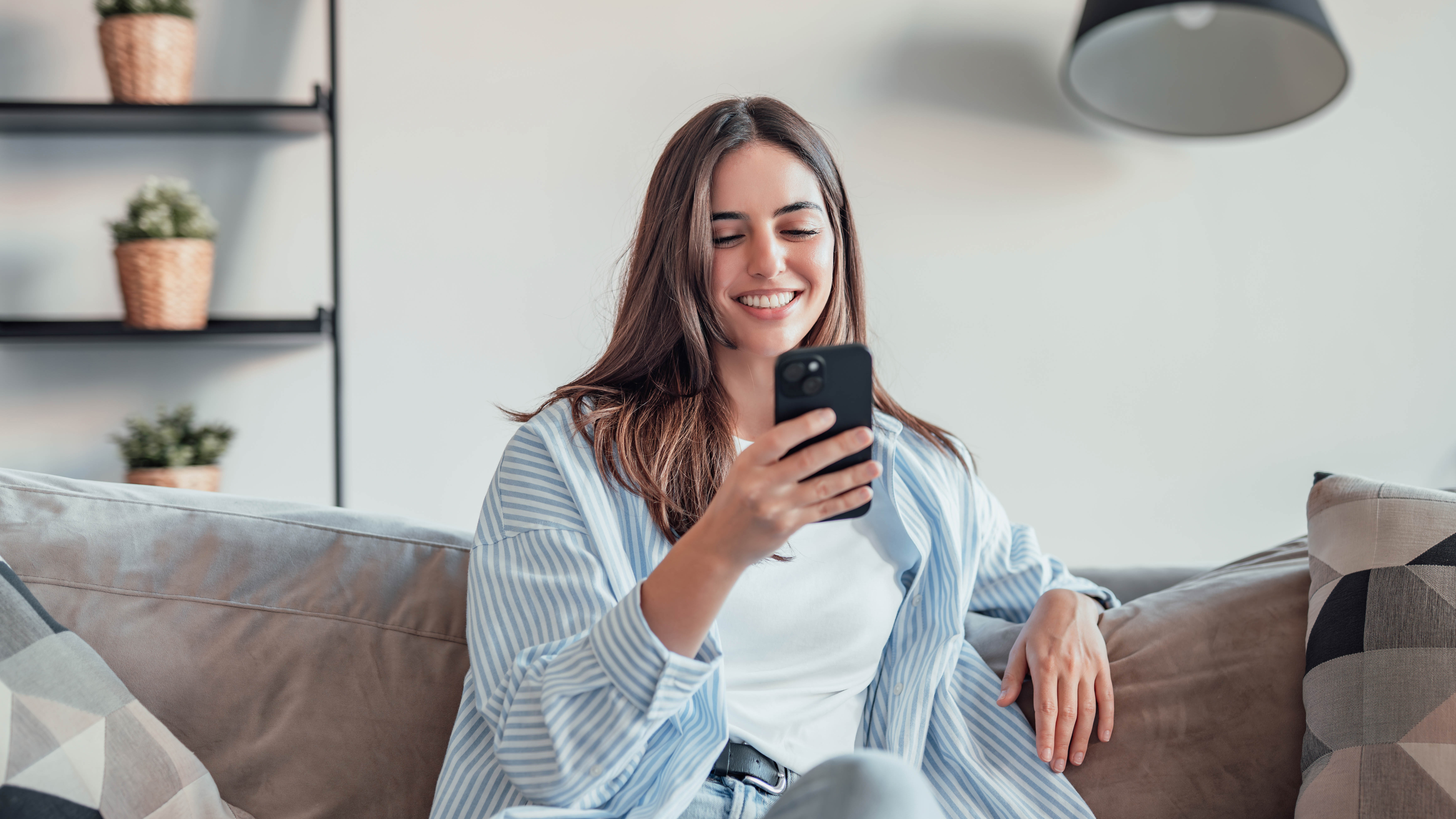 Patient reviewing financing options on her phone with confidence and ease